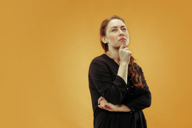 istock Young serious thoughtful business woman. Doubt concept. 1055912724