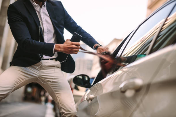 istock Businessman pulling out his handbag from a car 1055913626