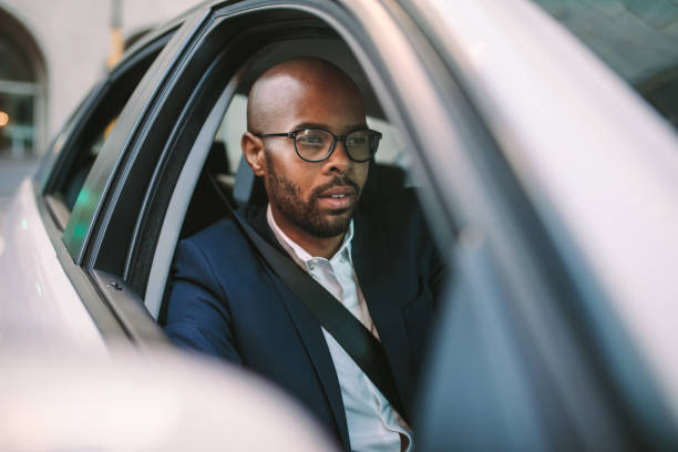 istock Businessman driving a car to office 1055913716
