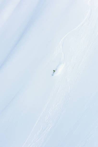 istock Freeride skier on powder snow 1055918212