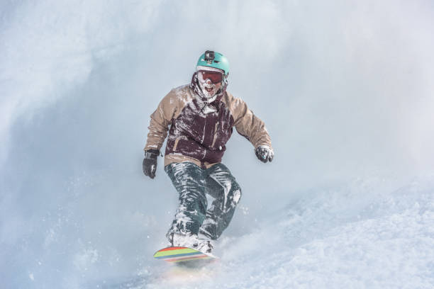 istock Snowboarder in powder snow 1055919570