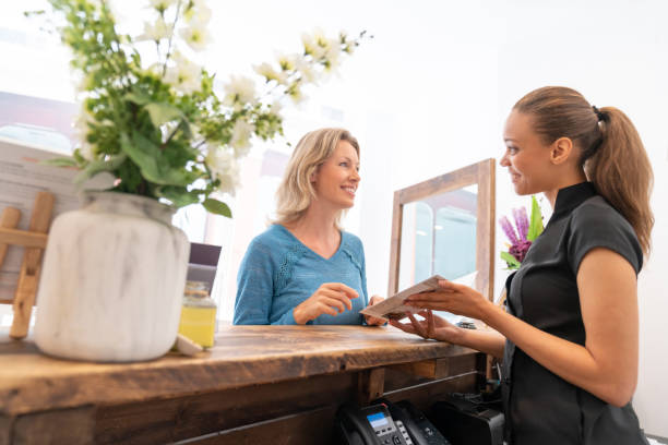 istock Masseuse offering massage services to a customer 1055919872