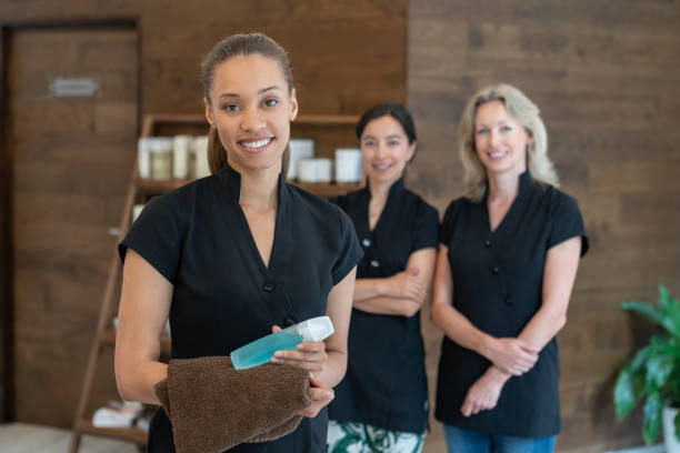 istock Happy group of masseuses working at a spa 1055920132