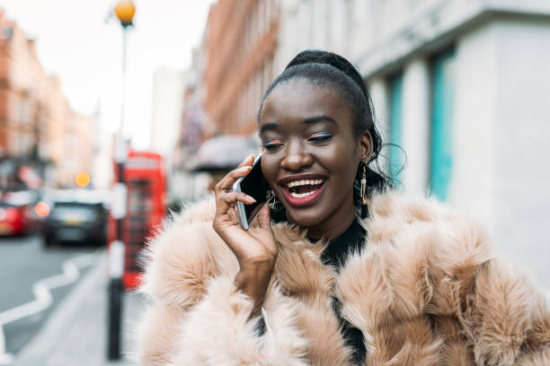 istock Black woman in London, UK, using smartphone 1055923264