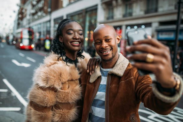 istock Non-caucasian tourists taking selfie 1055923800