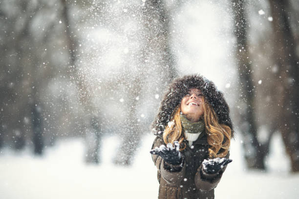 istock Young girl in the snow enjoying winter time 1055924042