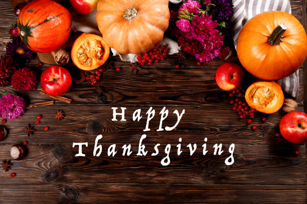 istock Autumnal composition with pumpkins on wooden table. November mood concept. 1055929850