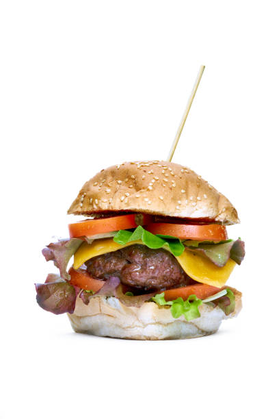 istock A cheese burger with lettuce, tomatoes and sesame bread bun 1055931002