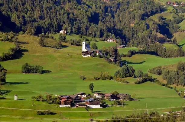 Austria, Tirol, homes and romanesque Saint Nikolaus church in Matrei , East-Tyrol