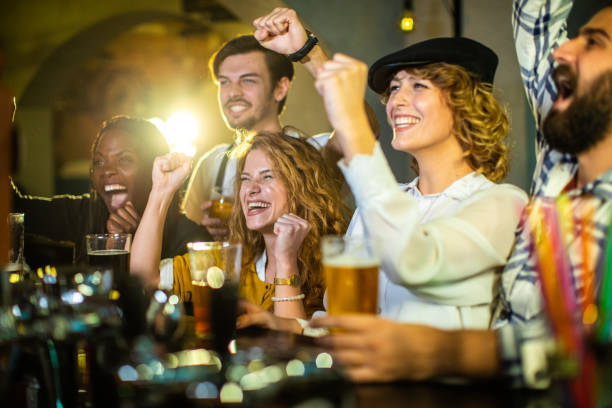 istock Enthusiastic Fans Watching TV Game 1055938078