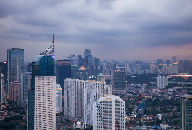 istock Central Jakarta aerial upper skyline under moody cloudy sky at twilight 1055938974