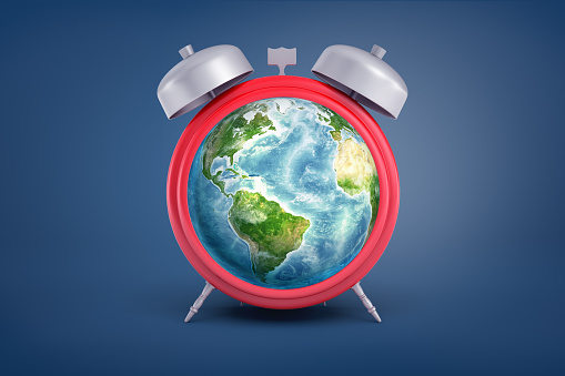 3d rendering of retro alarm clock with metal bells and an Earth globe instead of its face stands on a blue background. Time and money. Time for Earth. Environment protection time. Elements of this image are furnished by NASA (https://visibleearth.nasa.gov/)