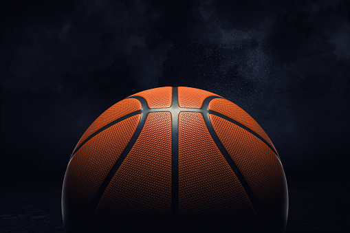 3d rendering of an orange rubber surface of a basketball ball shown on a black background. Basketball league. Team play. One ball in court.