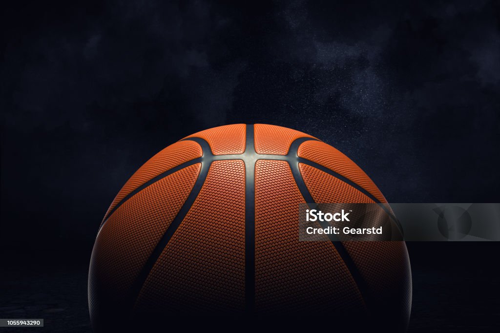 3d rendering of an orange rubber surface of a basketball ball shown on a black background. 3d rendering of an orange rubber surface of a basketball ball shown on a black background. Basketball league. Team play. One ball in court. Basketball - Sport Stock Photo