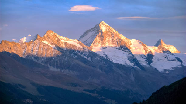 istock Sun is setting on Swiss mountains late september (Valais, Switzerland) 1055949478
