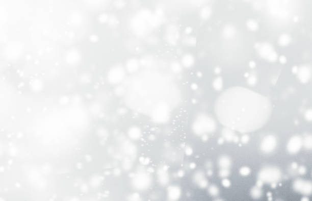 istock Silver  abstract bokeh background with snowflake and white glittering bokeh stars. A shiny holiday card. Glowing blurred lights