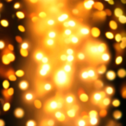 Goldn  Lights Festive background. Abstract Christmas twinkled bright background with bokeh defocused yellow lights