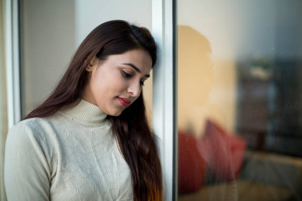 istock Worried young woman 1055953776