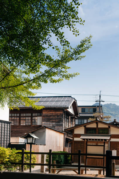 istock Old houses and Japanese ginko tree 1055953926