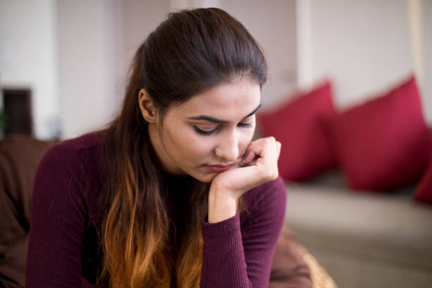 istock Sad young woman 1055954736