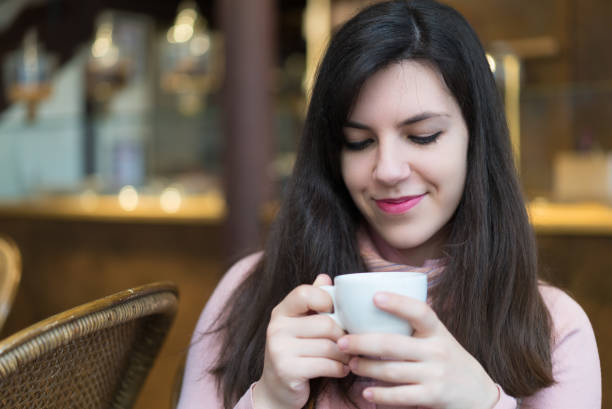 istock Brunette Beauty With Coffee in Coffee Shop 1055955074