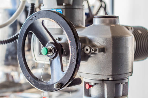 istock Equipment, cables and piping as found inside of a industrial workshop 1055955566