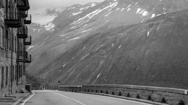 Road near the summit of the Furka pass in Switzerland. With an elevation of 2,429 metres it is a high pass connecting Gletsch, Valais with Realp, Uri.