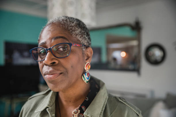 Portrait of a Curious Mature Woman A close-up portrait of a mature black woman looking curious. judgement free stock pictures, royalty-free photos & images