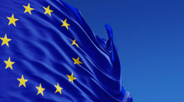 istock European Union Flag Waving With Wind On Blue Sky 1055959766
