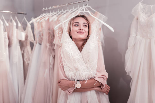 istock Positive beautiful woman dreaming about her wedding 1055961788