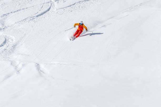 istock Freeride skier skiing towards camera 1055962362