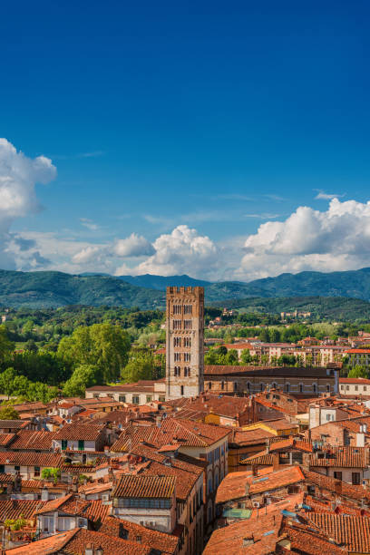 Lucca historic center (with copyspace above) Lucca old historic center skyline with medieval towers and clouds lucca italy stock pictures, royalty-free photos & images