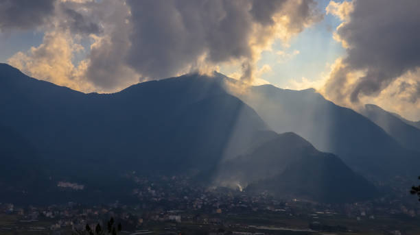 istock Sun rays coming out of clouds 1055964944