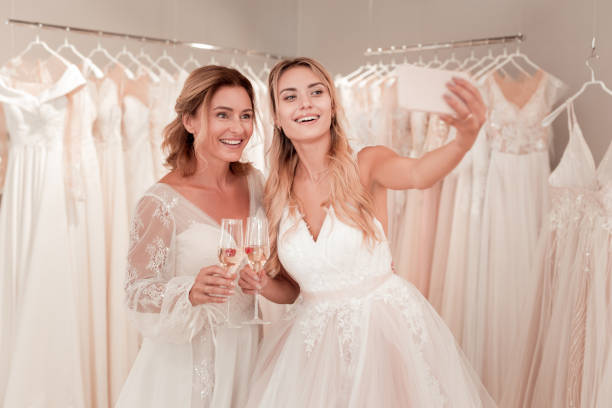 istock Positive beautiful brides posing for a photo 1055968164