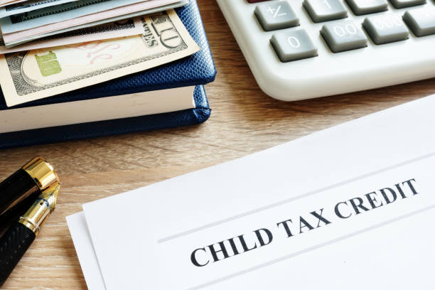 istock Child tax credit application in an office. 1055975744