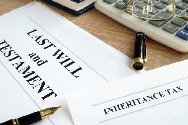 istock Inheritance tax and last will and testament on a desk. 1055975784