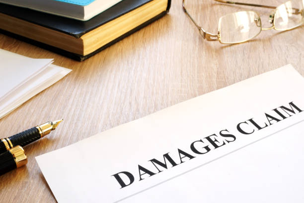 istock Damages claim form and pen. Insurance concept. 1055975820