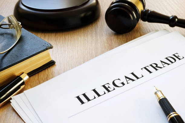 istock Illegal trade report, pen and gavel. 1055975848