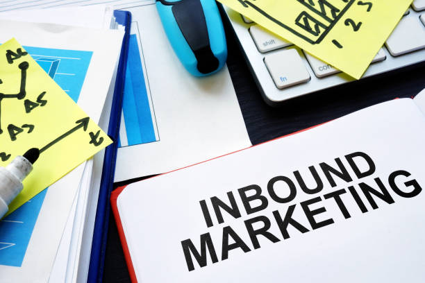 istock Inbound marketing. Book, reports and pen on table. 1055976074