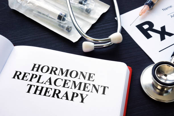 istock Book about Hormone Replacement Therapy and syringes. 1055976166