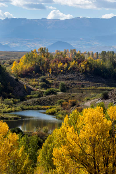 istock landscape mountains autumn pond 1055977696