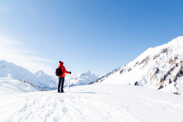 istock Woman in Snow Covered Mountains 1055980040