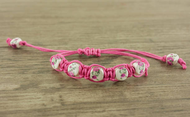 istock Beaded bracelet on wooden background 1055980292