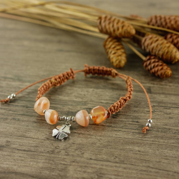 istock Bracelet on wooden background 1055980768