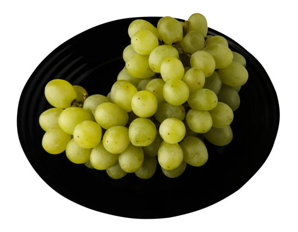 istock grapes isolated on white background. grapes on a plate 1055980796