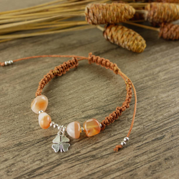 istock Bracelet on wooden background 1055980900