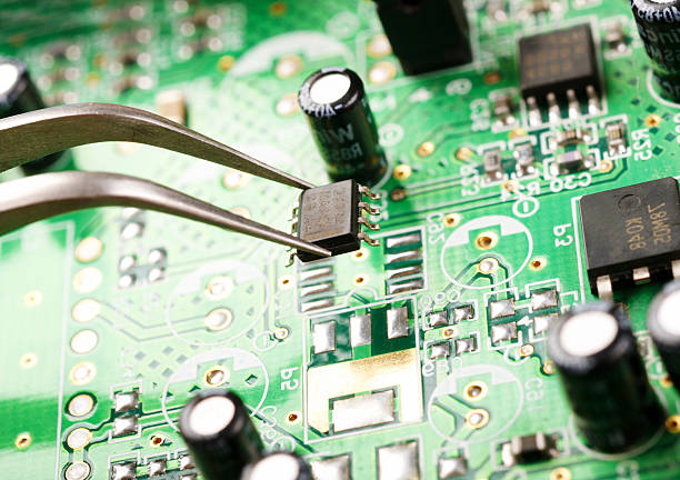 istock Closeup of a person assembling a circuit board 105598132