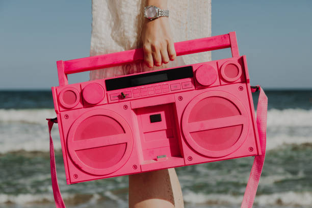 istock Retro portable stereo cassette recorder on the Beach 1055982482