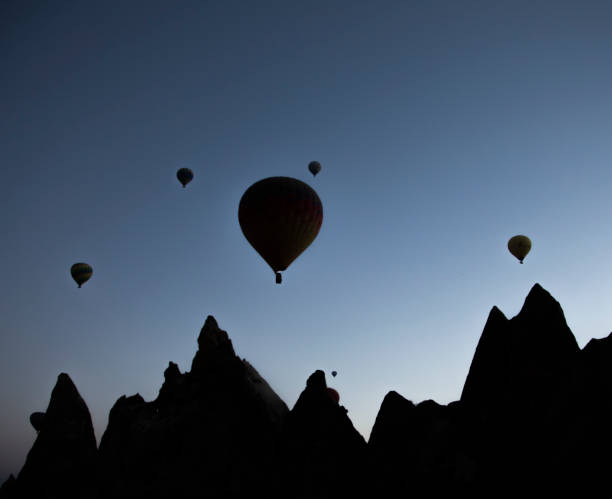 istock Hot air balloons silhouette  in Cappadocia 1055991074