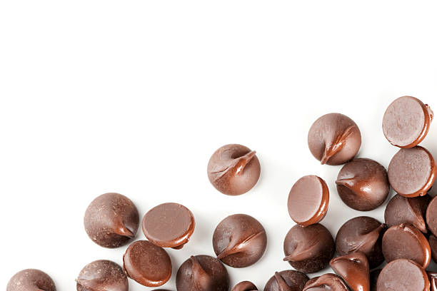 istock Scattering of brown chocolate chips on a white background 105600338